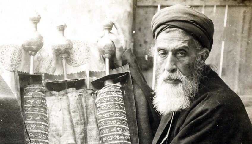 Archival photograph of a Samaritan priest beside a Torah scroll, from Abood’s book